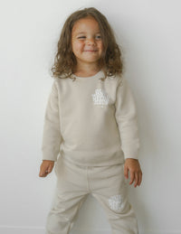 Our World Needs Jesus Beige Kids Crewneck Christian Sweatshirt